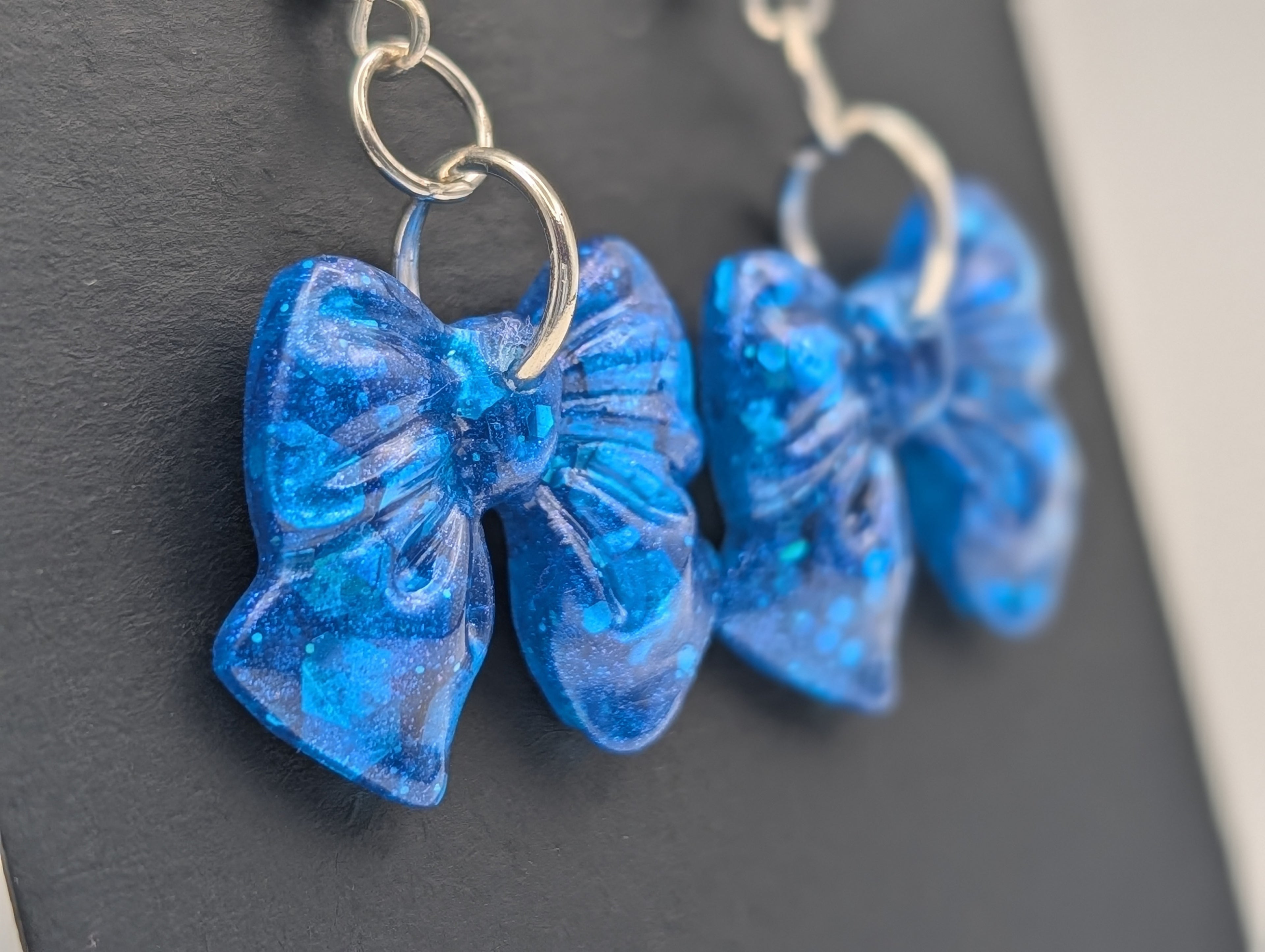 Cerulean Stardust Bows - Silver Plated Drop Earrings