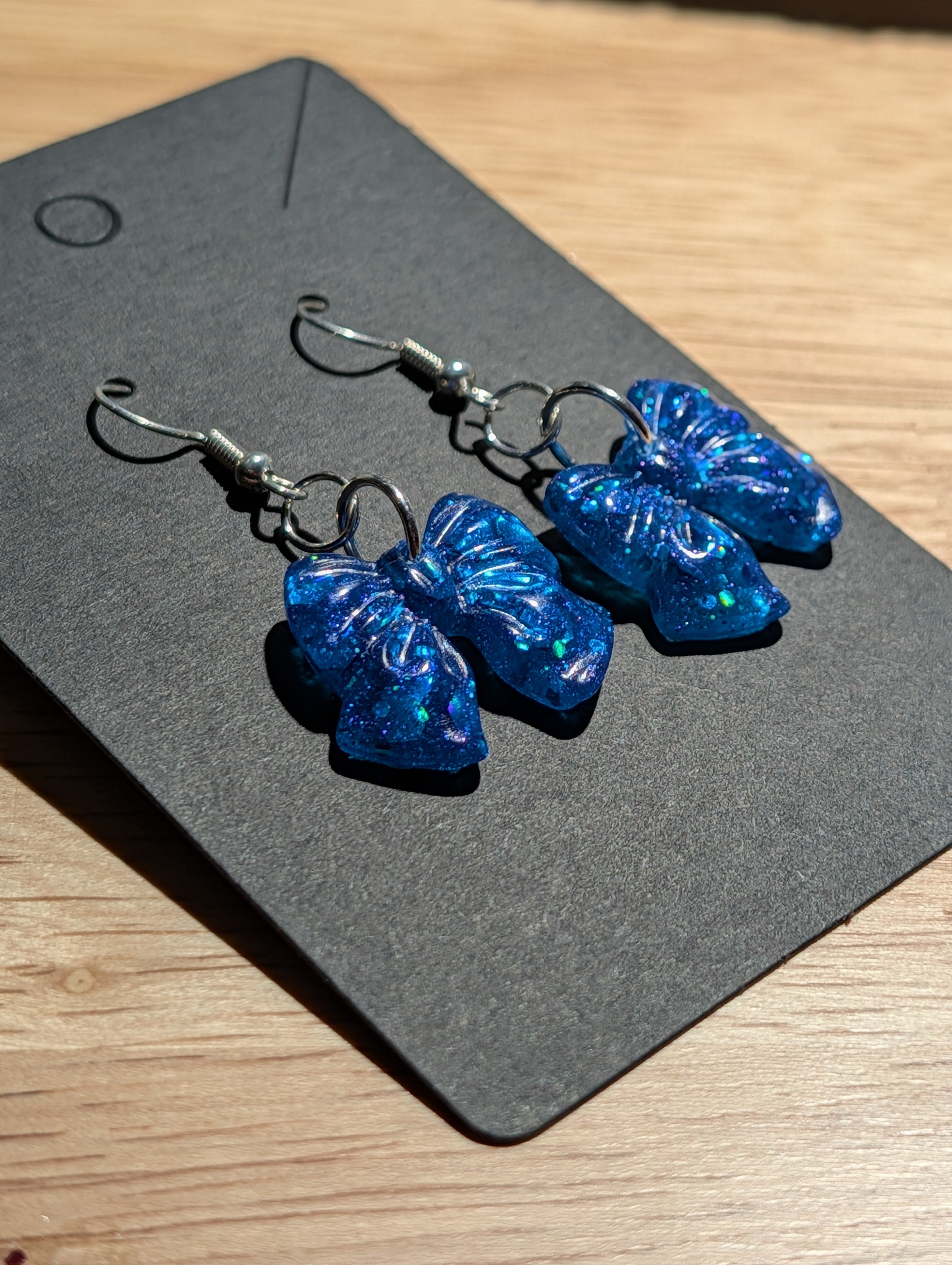 Cerulean Stardust Bows - Silver Plated Drop Earrings